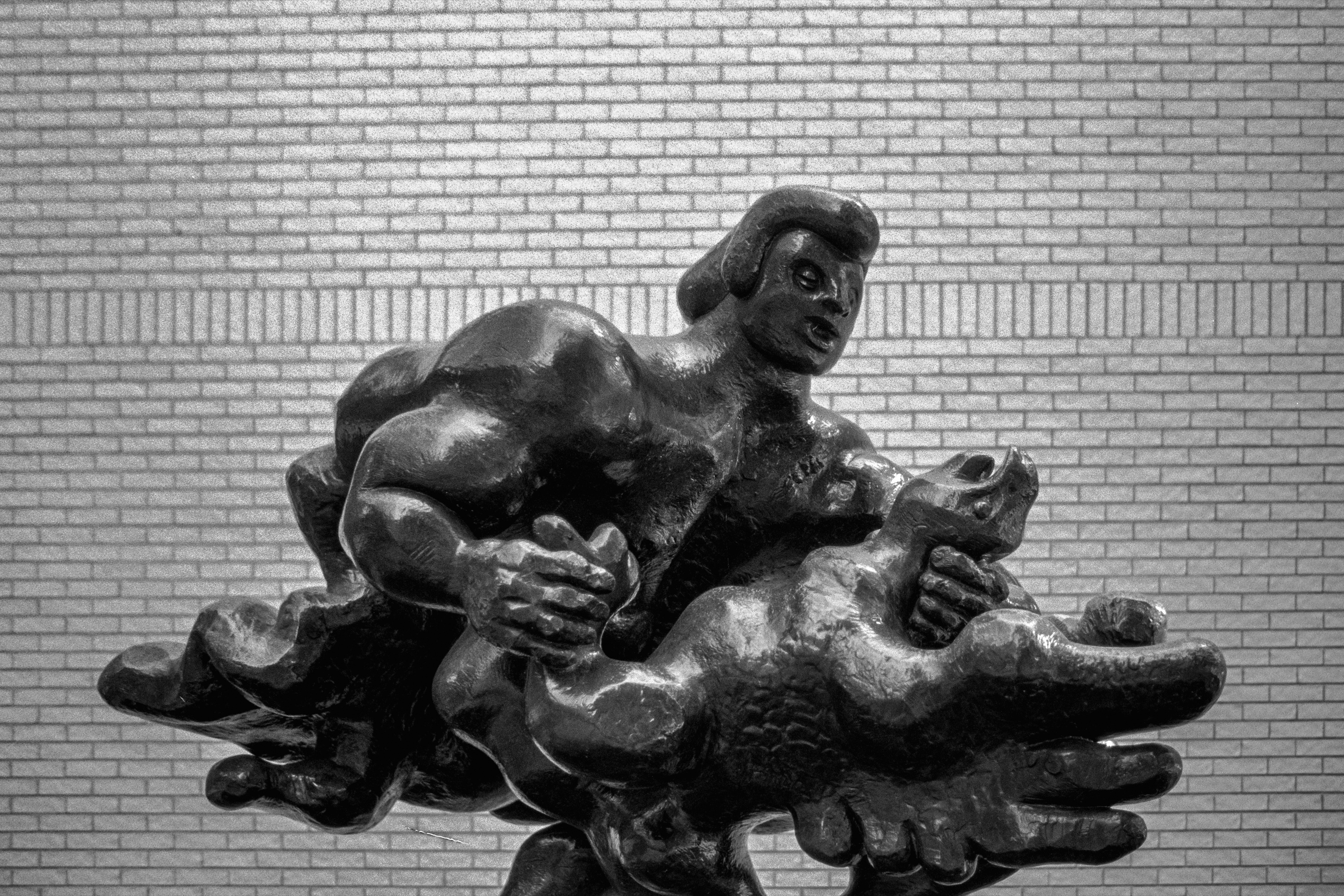 An Hour at the MIA: Bronze figure against brick