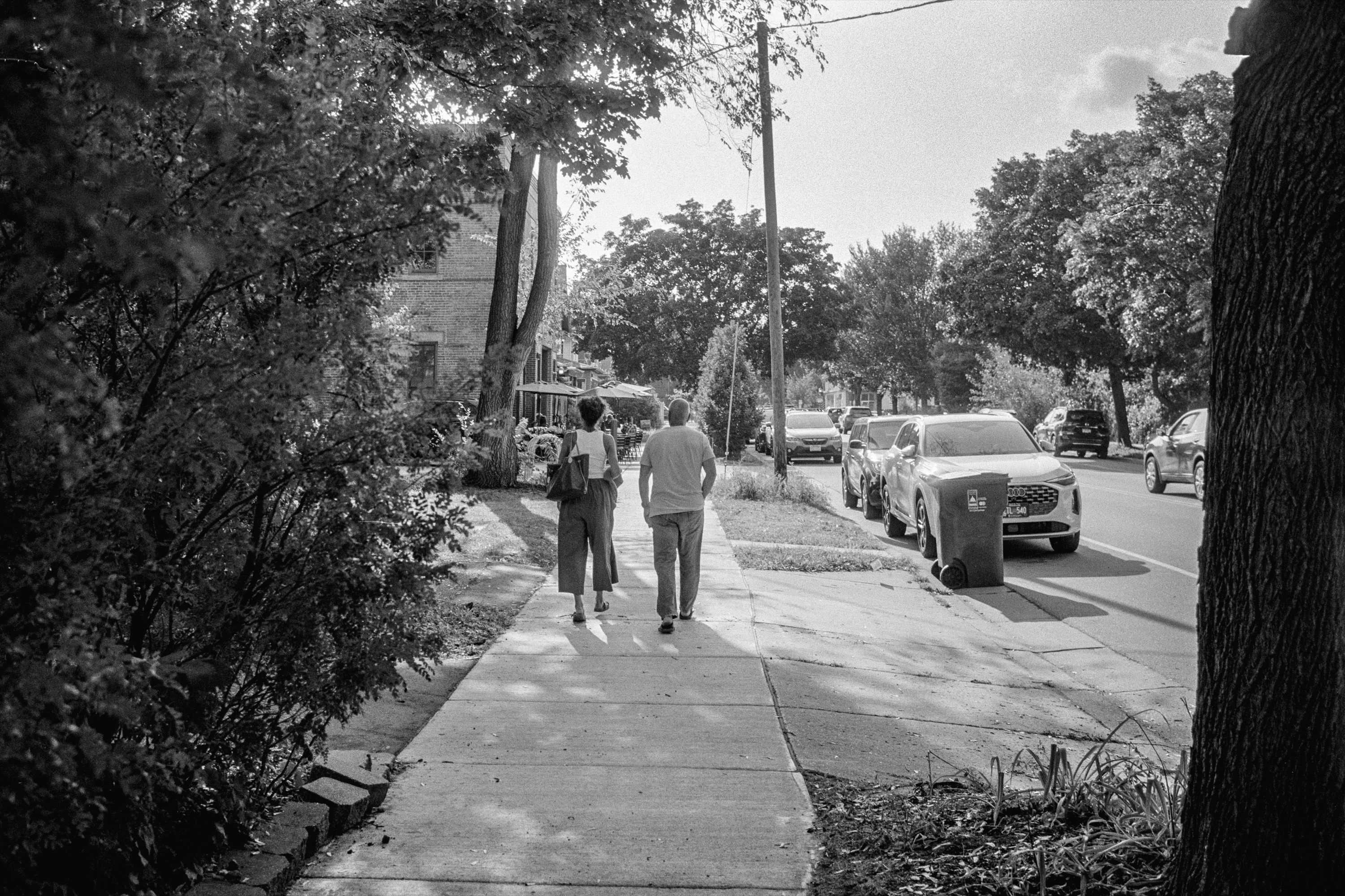An Hour at the MIA: Two figures on the sidewalk, New Prague