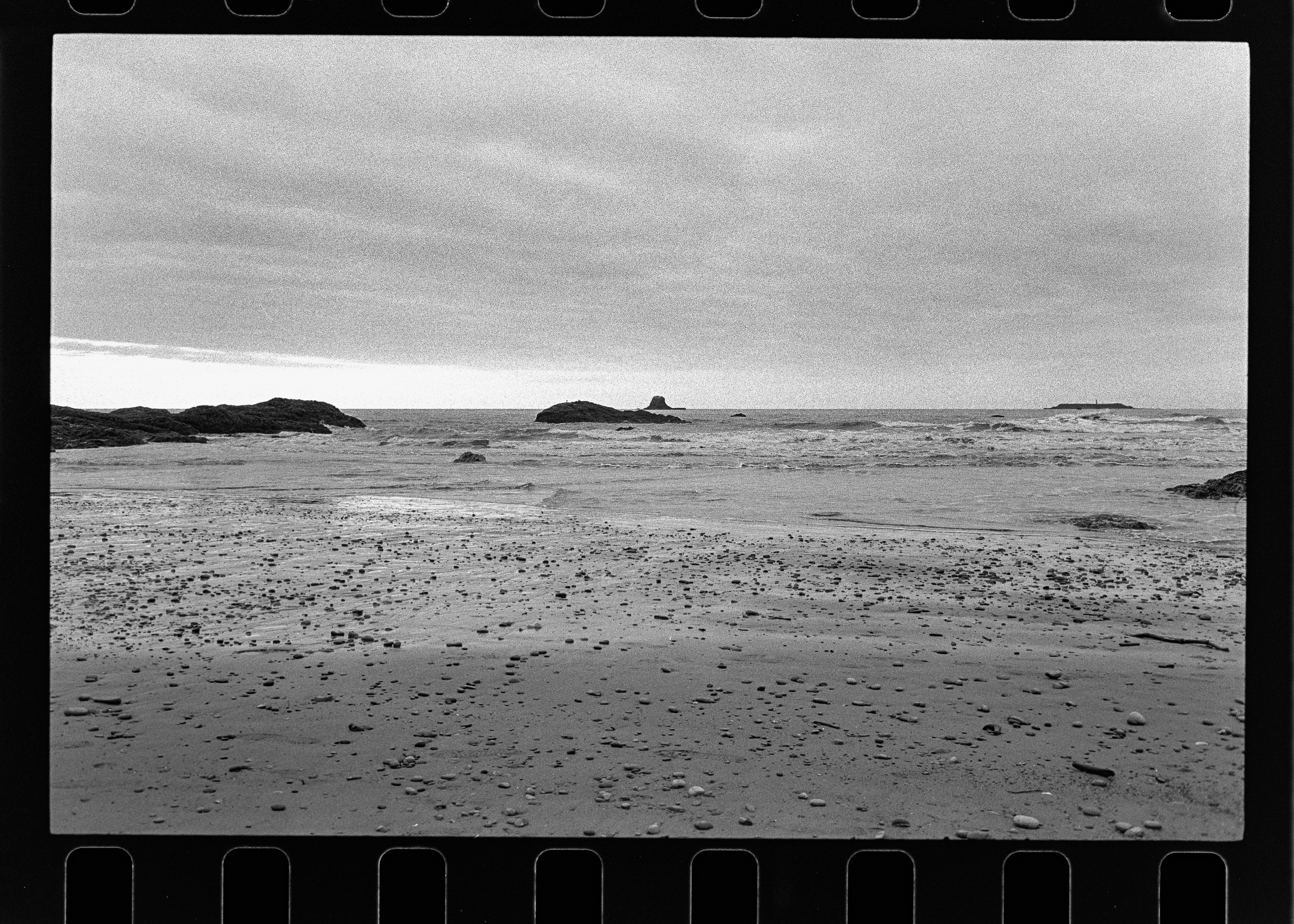 Wide beach with distant sea stacks