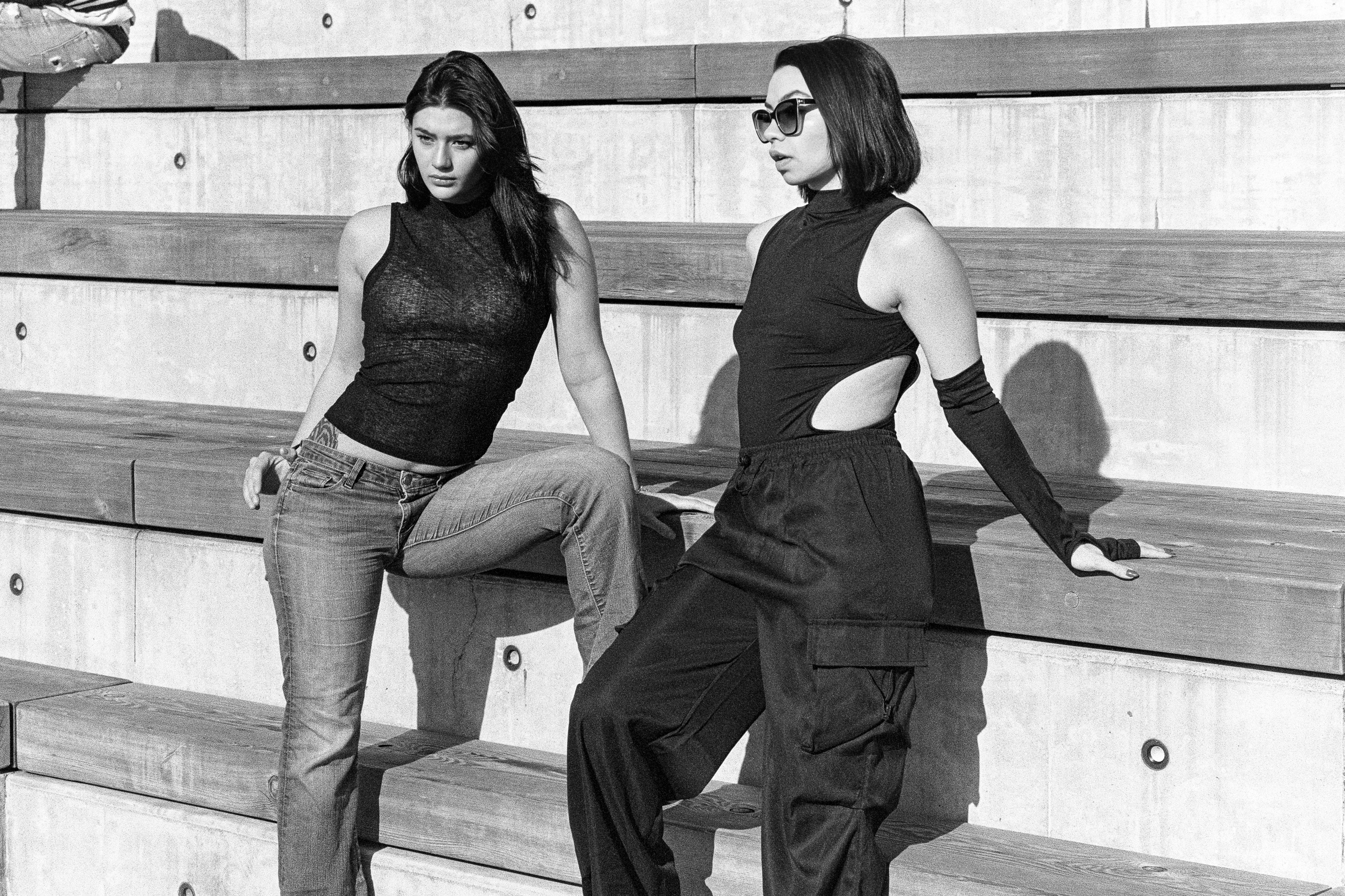 Two models on the bleachers, standing